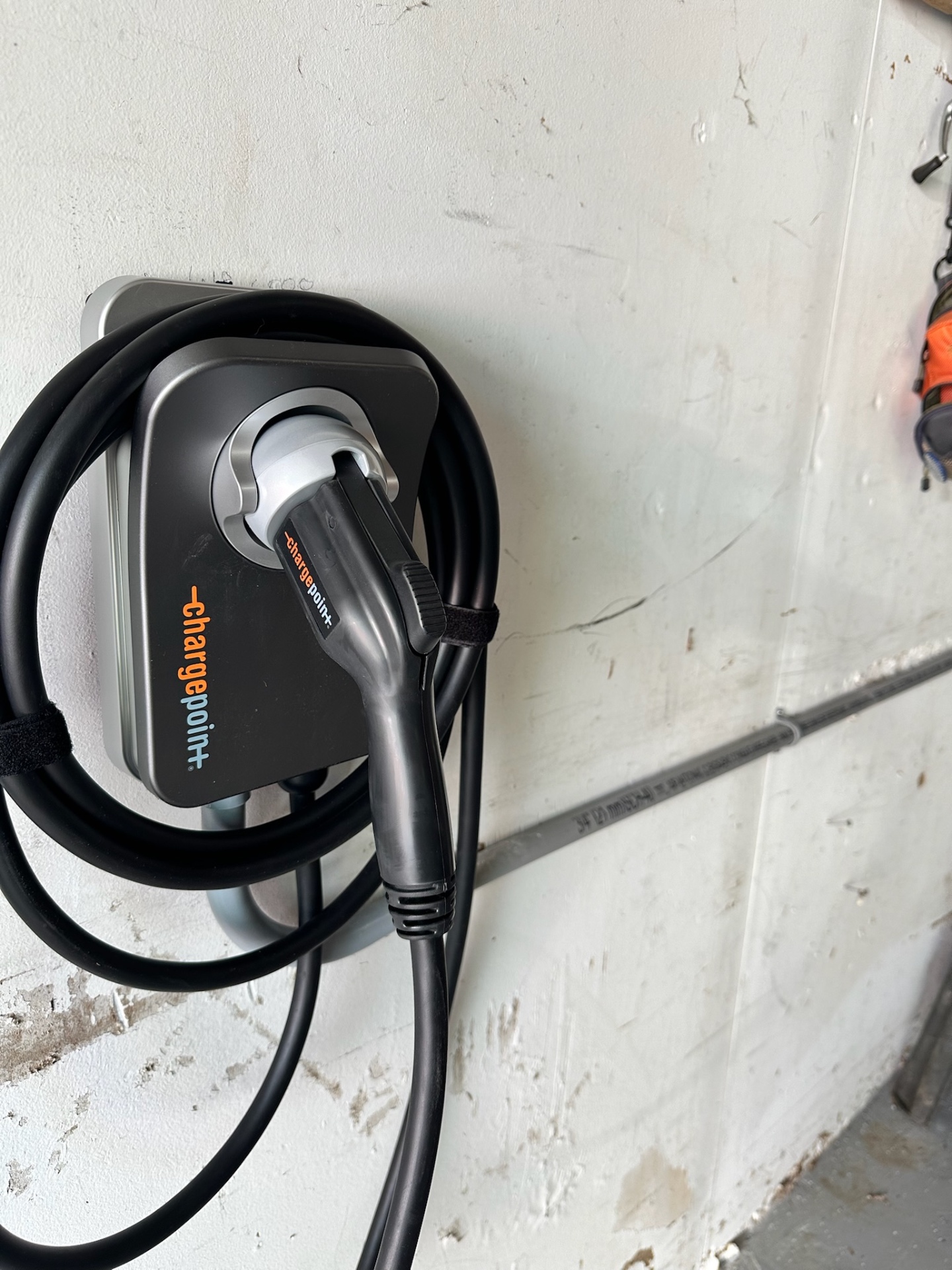 ChargePoint Home Flex Level 2 charger installed in a garage with neatly coiled charging cable